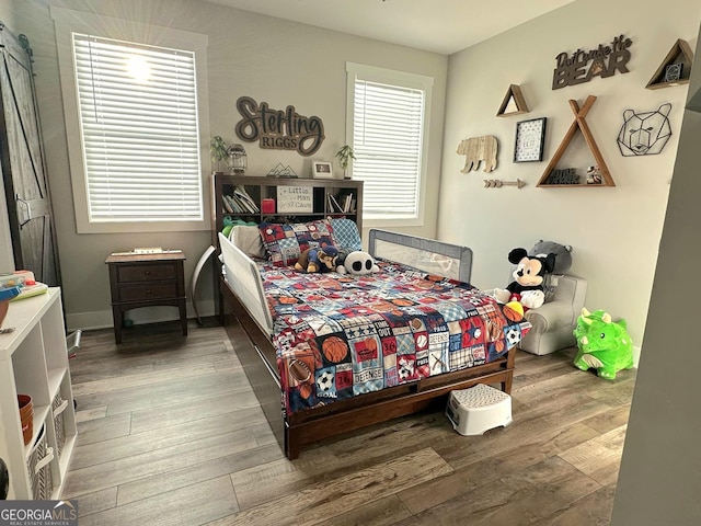 bedroom with wood-type flooring