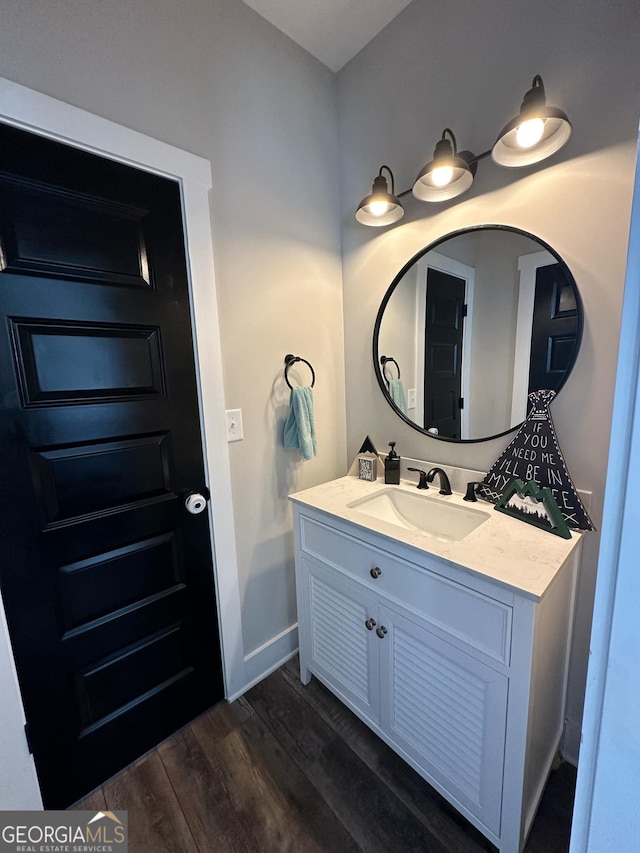 bathroom with vanity and hardwood / wood-style flooring