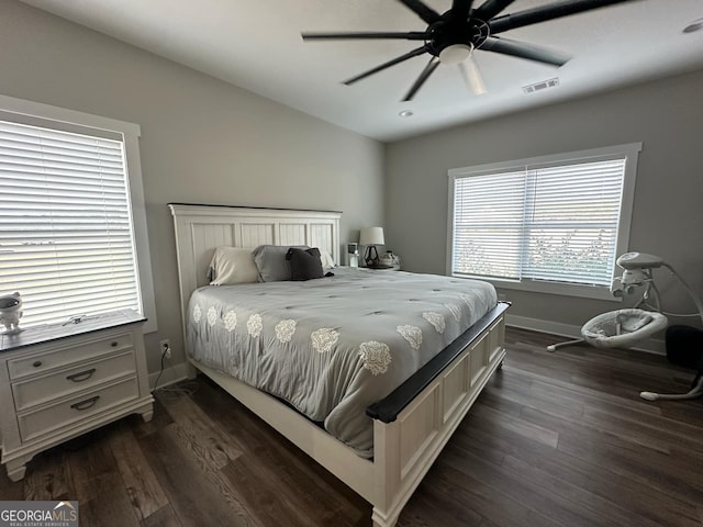 bedroom featuring dark wood-type flooring and ceiling fan