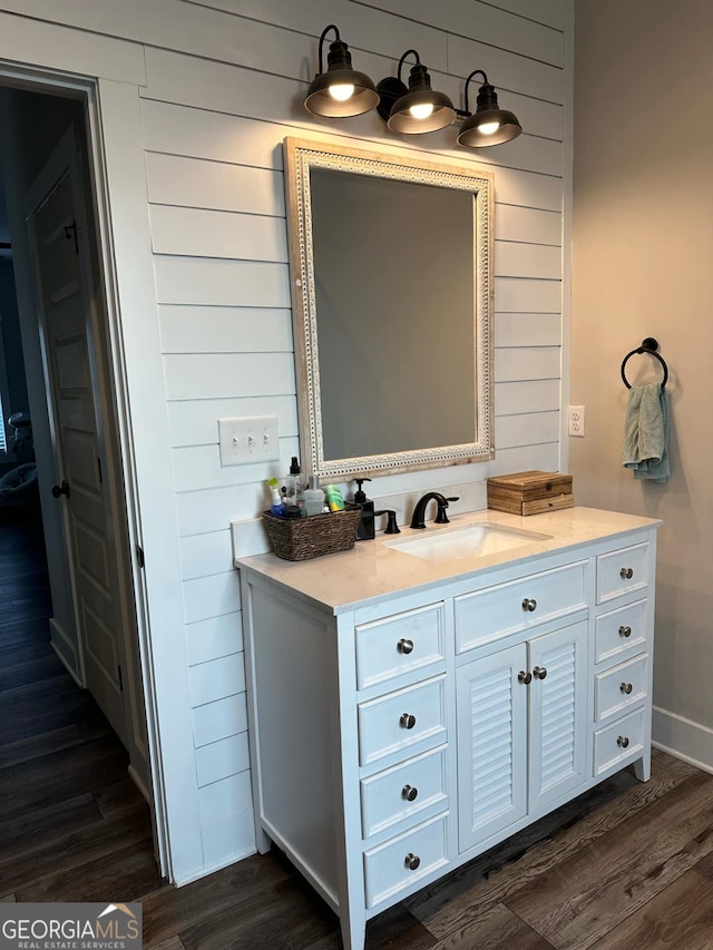 bathroom with wood-type flooring and vanity