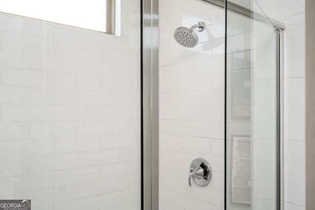 full bathroom featuring a shower stall