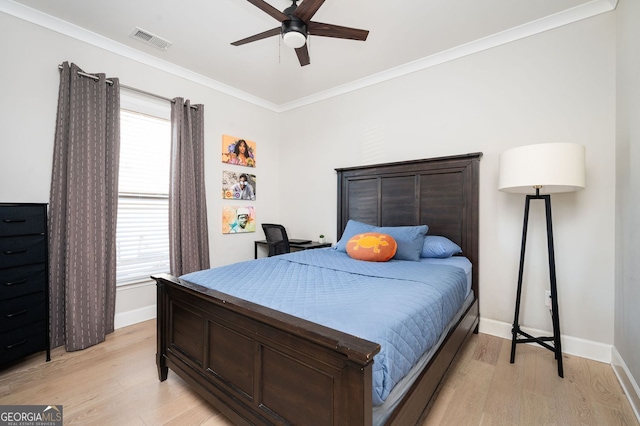 bedroom with crown molding, ceiling fan, and light wood-type flooring