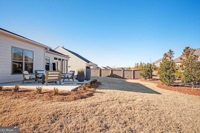view of yard with a fenced backyard and a patio
