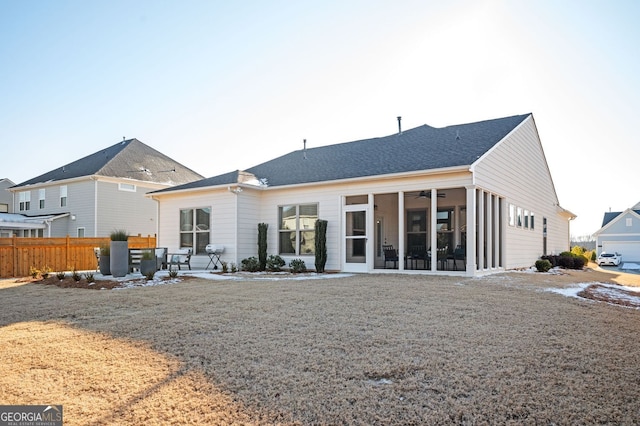 back of property featuring a patio area and a sunroom