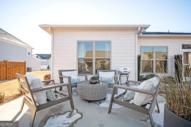 view of patio with fence and an outdoor hangout area