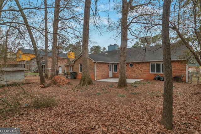 back of house with central AC and a patio area