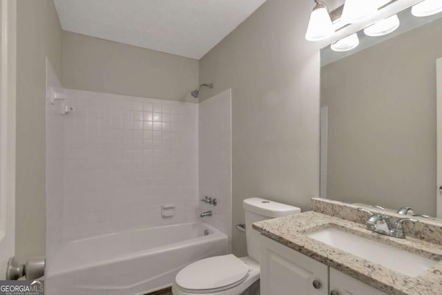 full bathroom featuring tiled shower / bath combo, vanity, and toilet