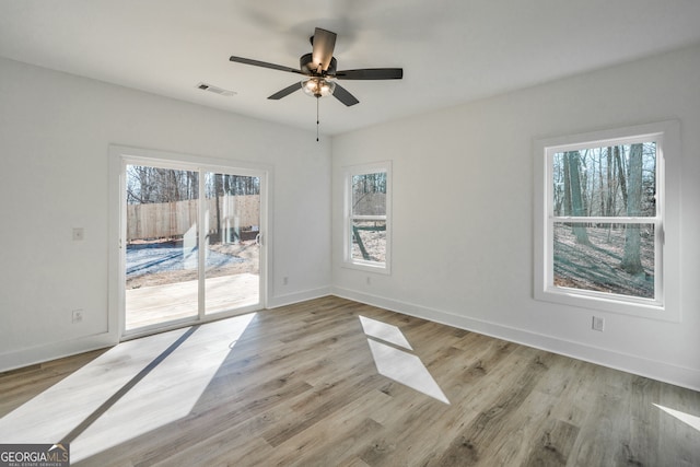 unfurnished room featuring ceiling fan and light hardwood / wood-style flooring