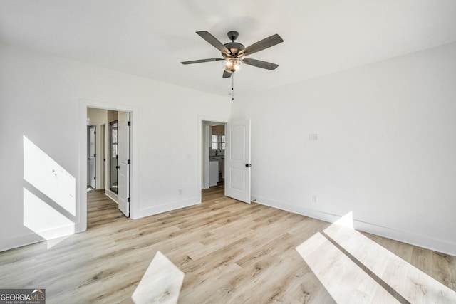 empty room with light hardwood / wood-style floors and ceiling fan