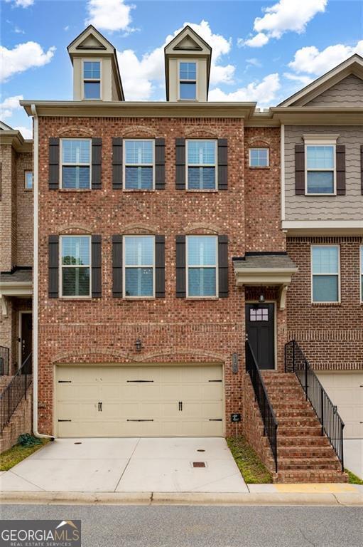 multi unit property featuring a garage