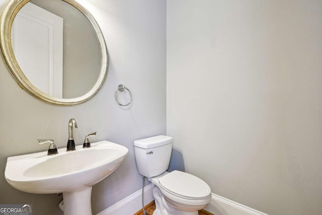 bathroom with toilet and sink