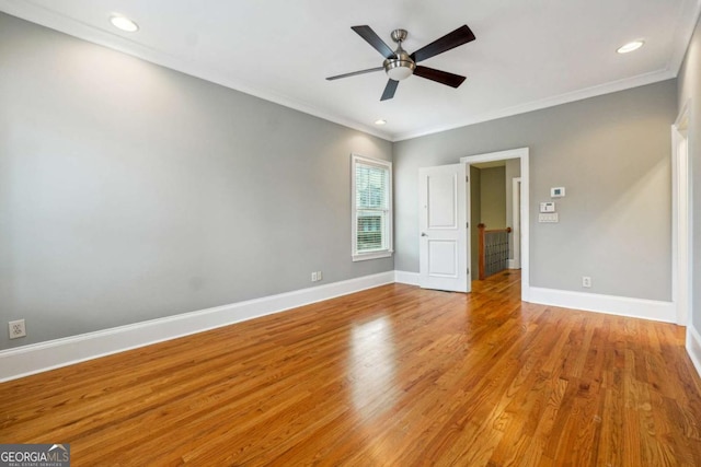 unfurnished bedroom with light hardwood / wood-style flooring, ornamental molding, and ceiling fan