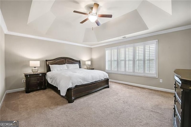 bedroom with a raised ceiling, ornamental molding, light carpet, and ceiling fan