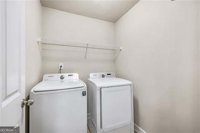 washroom with washing machine and dryer