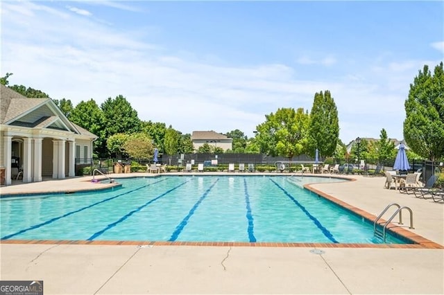 view of pool featuring a patio area