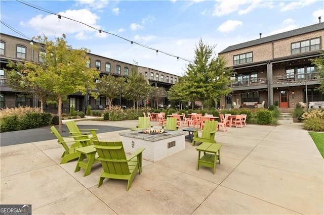 view of home's community featuring a patio and a fire pit