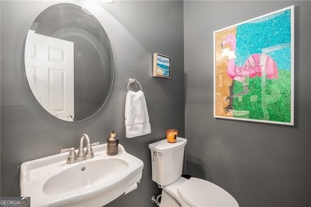 bathroom with sink and toilet