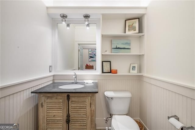 bathroom featuring vanity and toilet