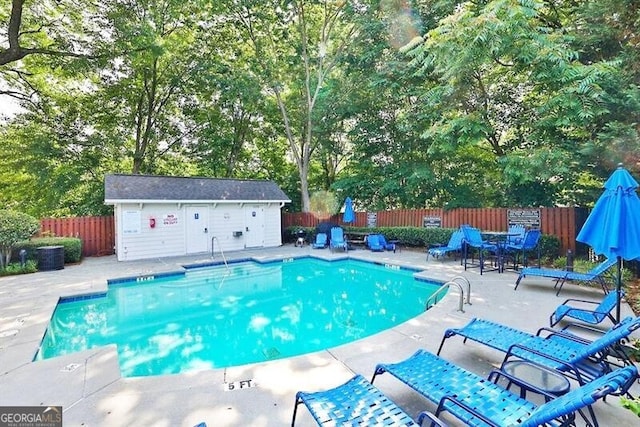 view of swimming pool with a patio area