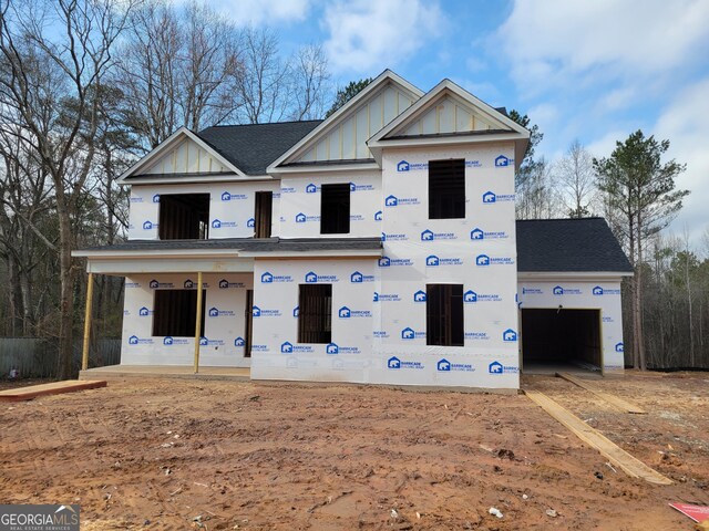 property under construction featuring a porch and a garage