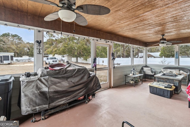 sunroom / solarium with wooden ceiling and ceiling fan