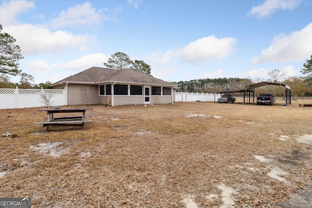 exterior space with a carport and a sunroom