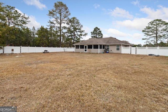 view of yard with a sunroom