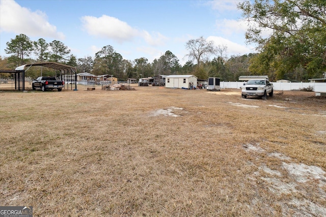 view of yard with a carport