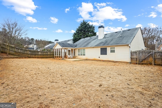 rear view of property with a patio area