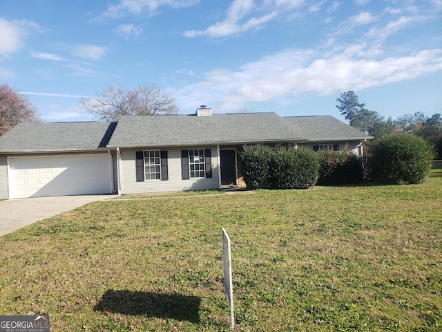 ranch-style home with a garage and a front yard