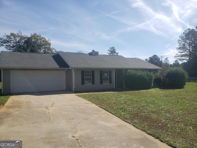 ranch-style house with a garage and a front yard