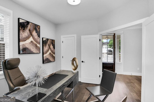 office area featuring dark wood-type flooring