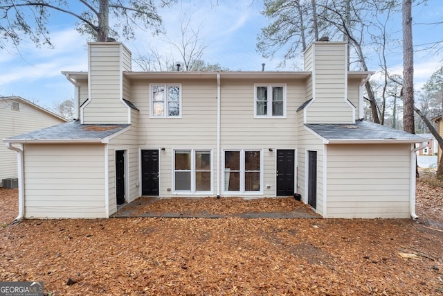 rear view of property with central air condition unit