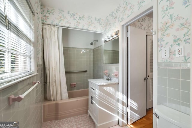 full bathroom featuring vanity, tile patterned floors, toilet, and shower / bath combo with shower curtain