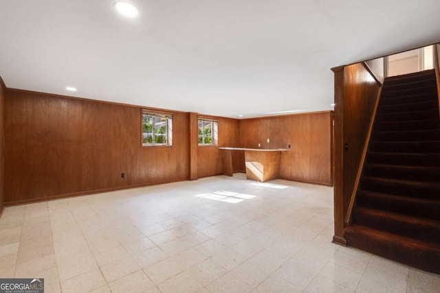 interior space featuring wood walls