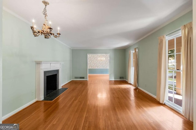 unfurnished living room with crown molding, light hardwood / wood-style floors, and a wealth of natural light