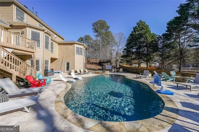 view of pool featuring a patio area