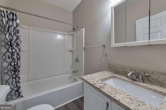 1333 Womack Ave, Atlanta, GA 30344 - full bathroom featuring vanity, hardwood / wood-style floors, toilet, and shower / bath combo