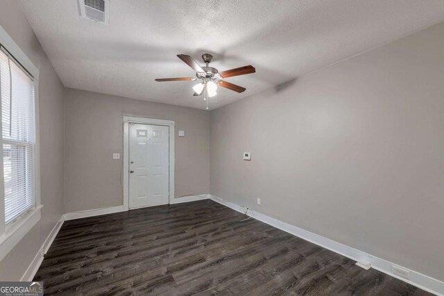 1333 Womack Ave, Atlanta, GA 30344 - unfurnished room featuring ceiling fan, dark hardwood / wood-style flooring, and a textured ceiling
