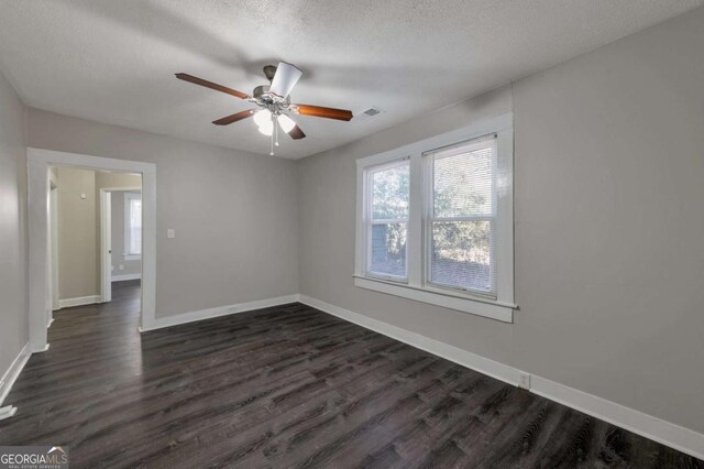 1333 Womack Ave, Atlanta, GA 30344 - spare room featuring dark hardwood / wood-style flooring, ceiling fan, and a textured ceiling