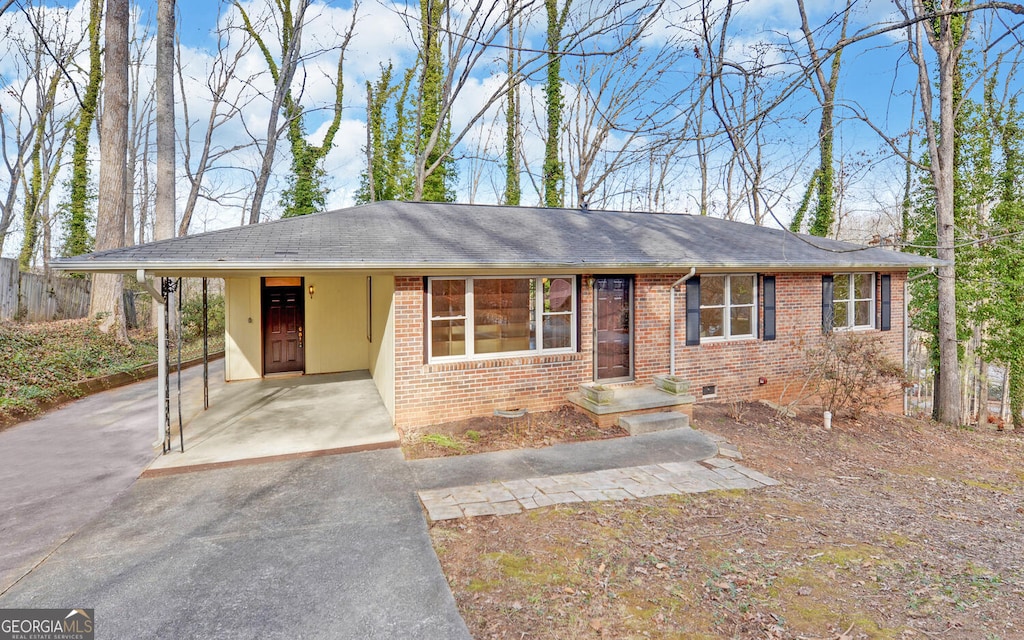 ranch-style home featuring a carport