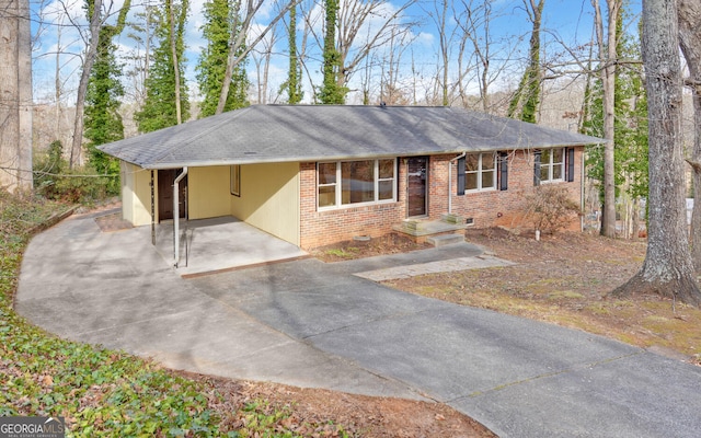 ranch-style house with a carport