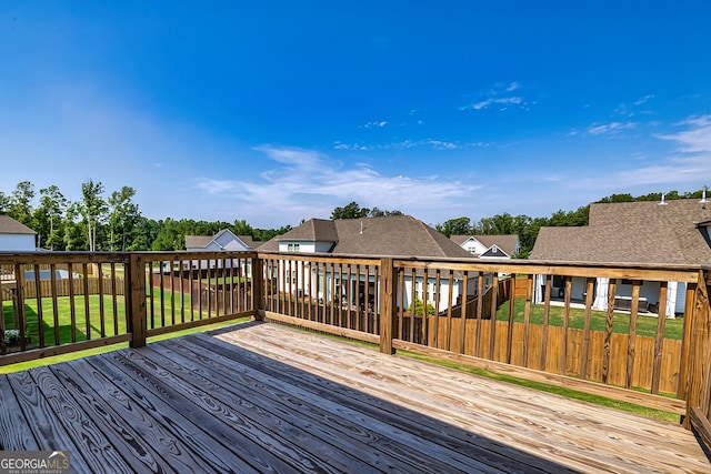 wooden deck with a yard