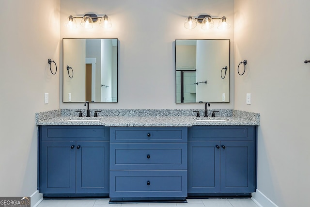 bathroom with vanity and tile patterned flooring