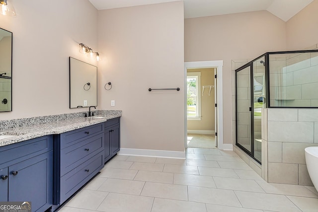 bathroom featuring vanity, lofted ceiling, tile patterned floors, and separate shower and tub