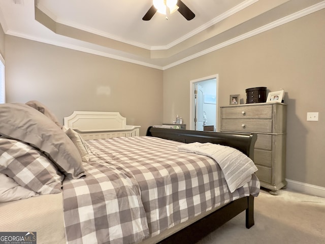 carpeted bedroom featuring crown molding, a raised ceiling, and ceiling fan