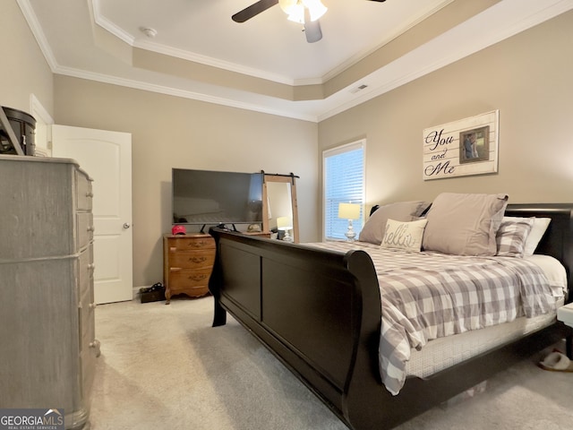 bedroom with crown molding, ceiling fan, a raised ceiling, and light carpet