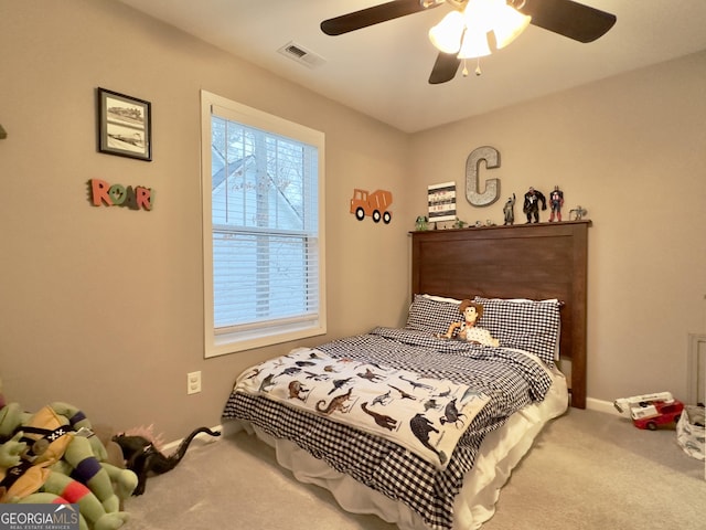 carpeted bedroom featuring ceiling fan