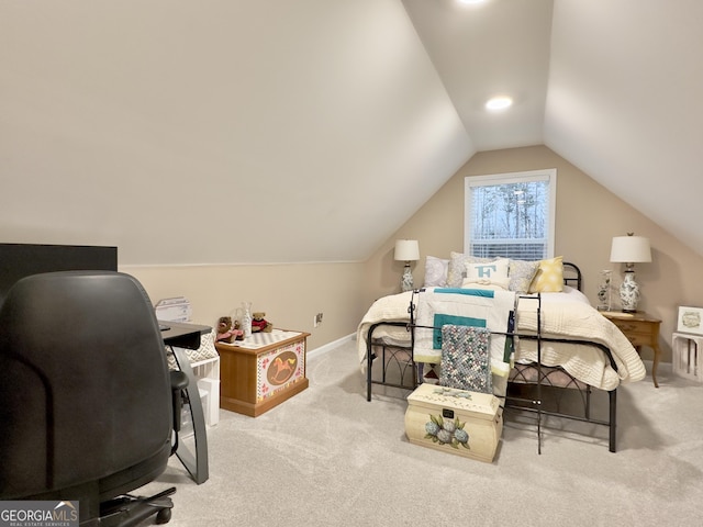 bedroom featuring lofted ceiling and light carpet