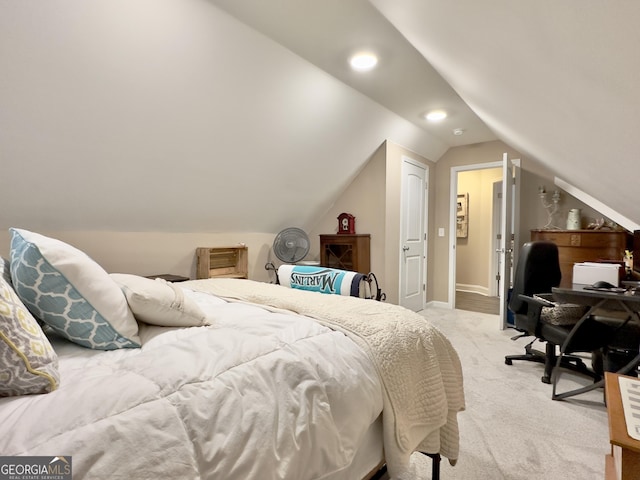 carpeted bedroom featuring vaulted ceiling